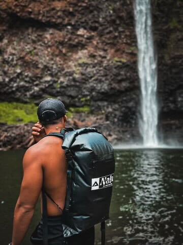 Nalu Black Dry Bag Backpack - Full and on man's back | Nalu Gear