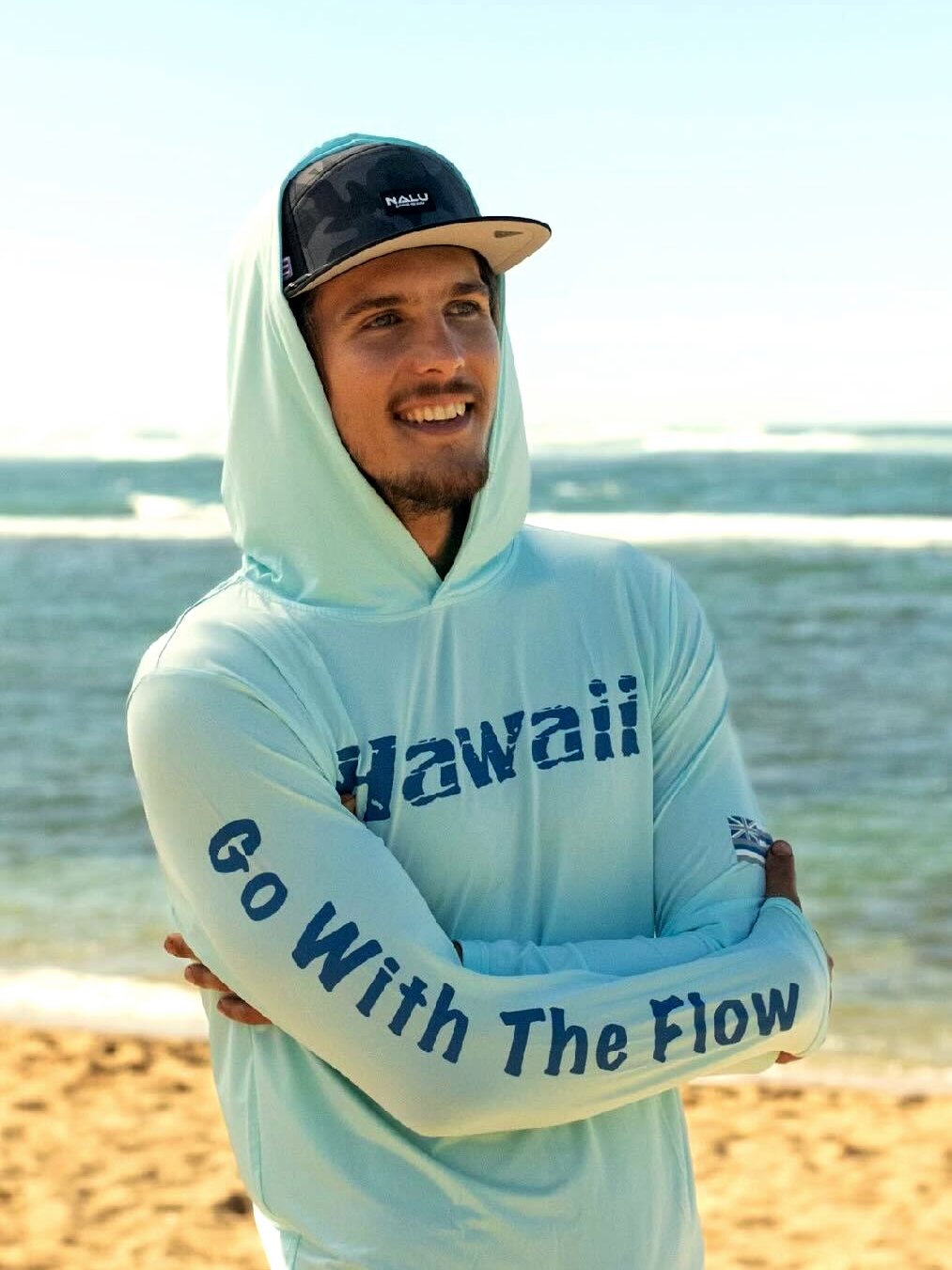 Nalu Go with the Flow Hooded Long Sleeve - Blue, front, worn on the beach