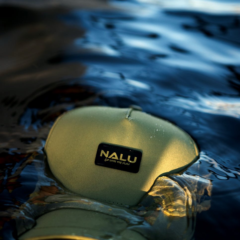 Nalu Green Waterproof Hat, floating on the water
