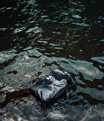 Nalu Black Dry Bag Backpack - Empty and in water | Nalu Gear