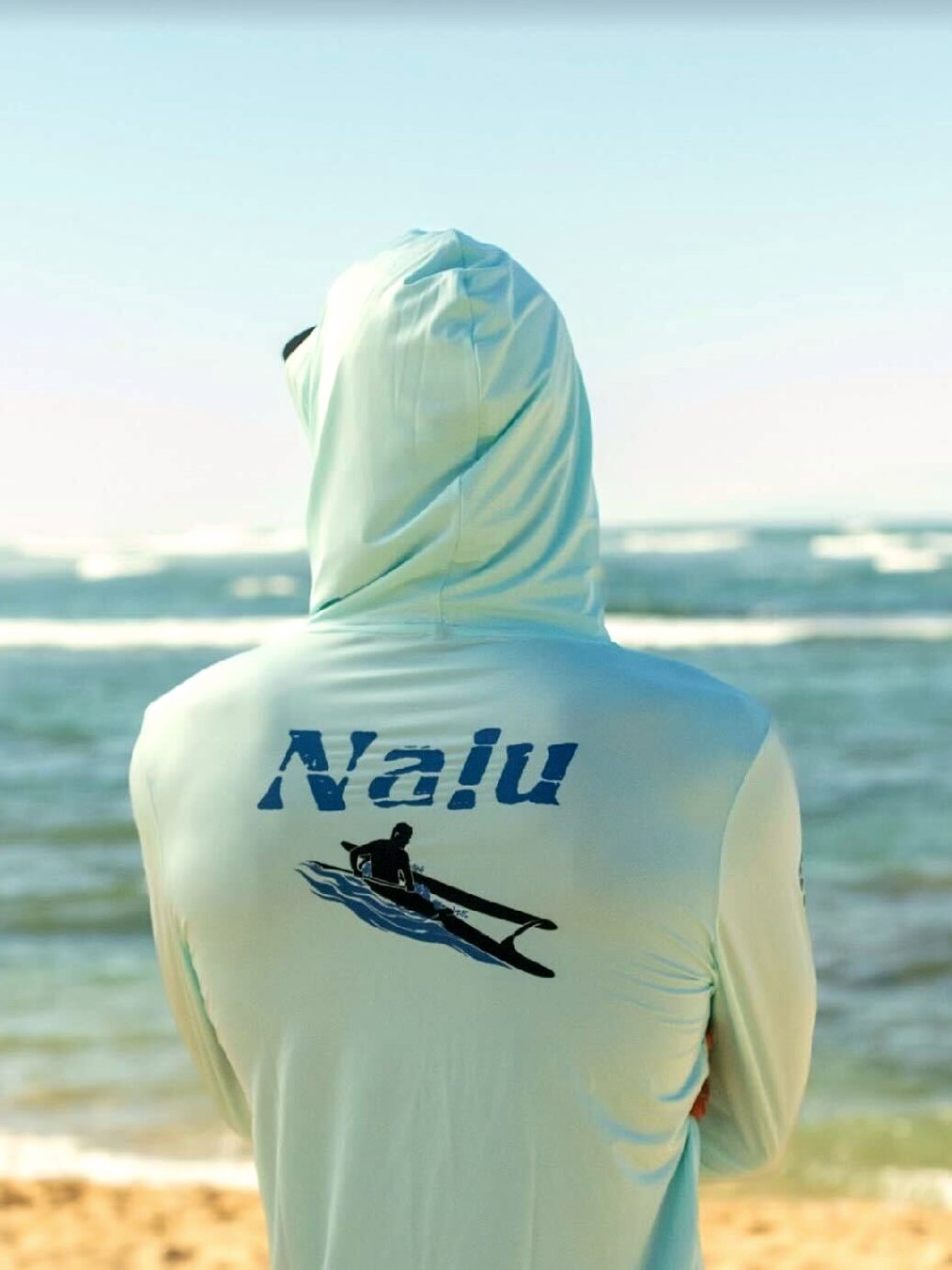Nalu Go with the Flow Hooded Long Sleeve - Blue, back, worn on the beach