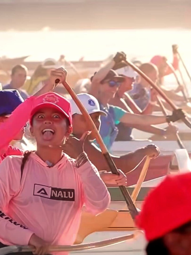 Nalu Go with the Flow Hooded Long Sleeve - Pink, worn by a paddling crew