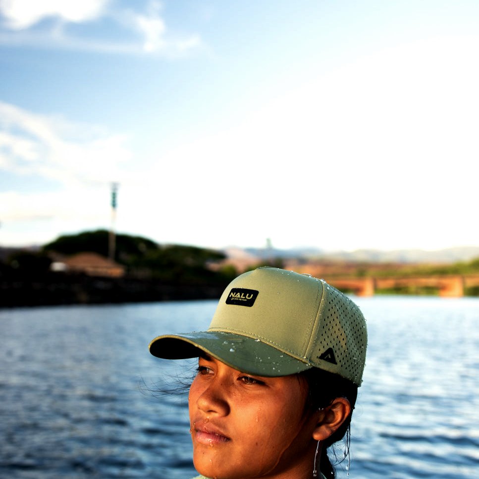 Nalu Green Waterproof Hat, worn at the water